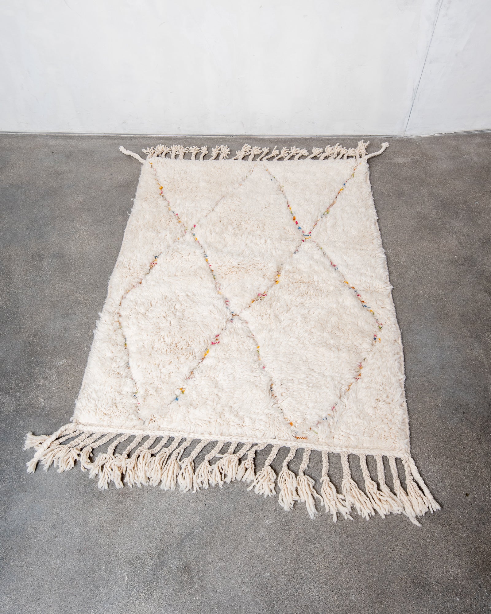 Modern, designer, handcrafted Berber rug from Morocco. Beniourain carpet with beautiful colours and patterns and fluffy wool texture.